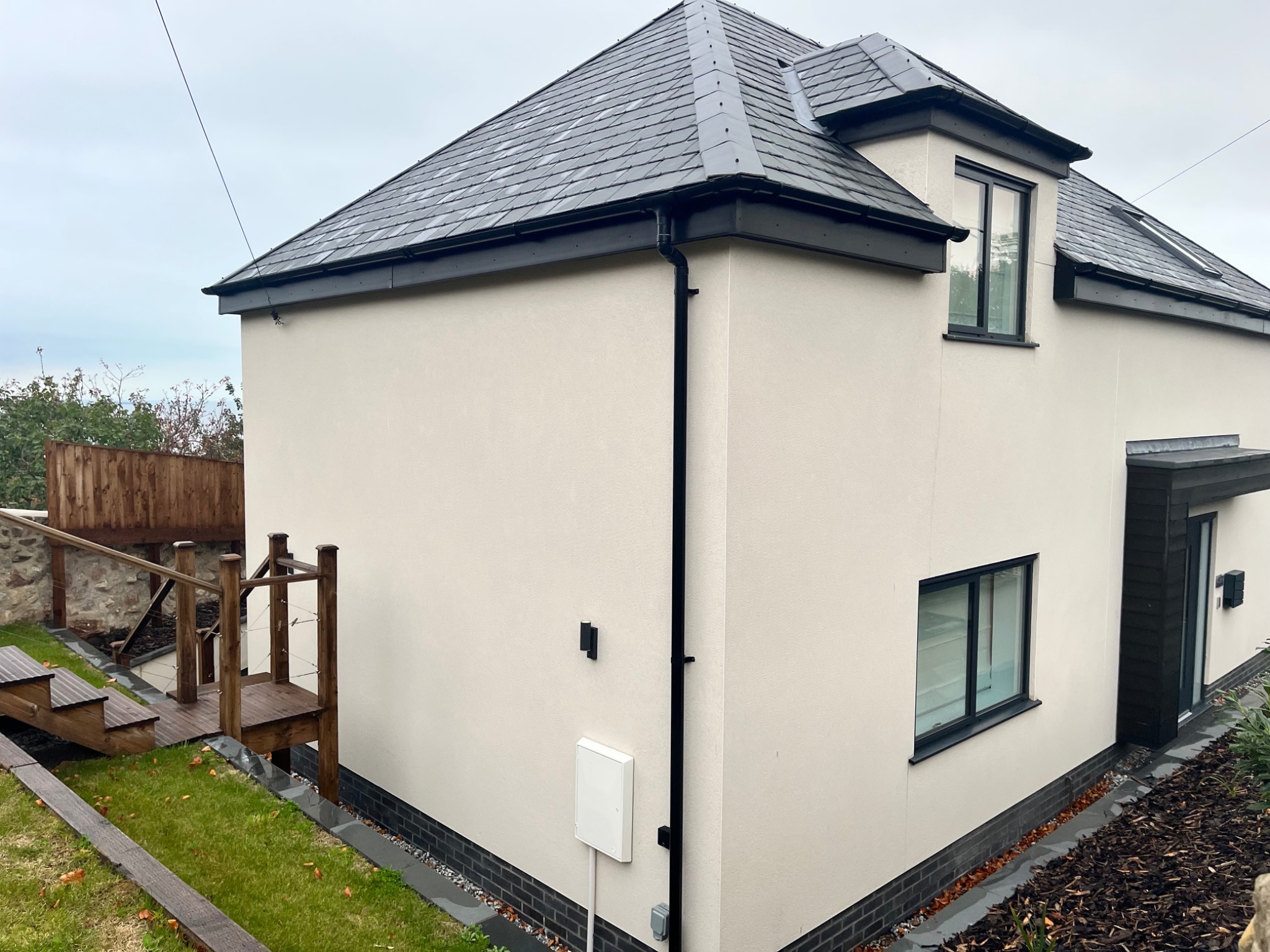 Light render finish with dark detailing